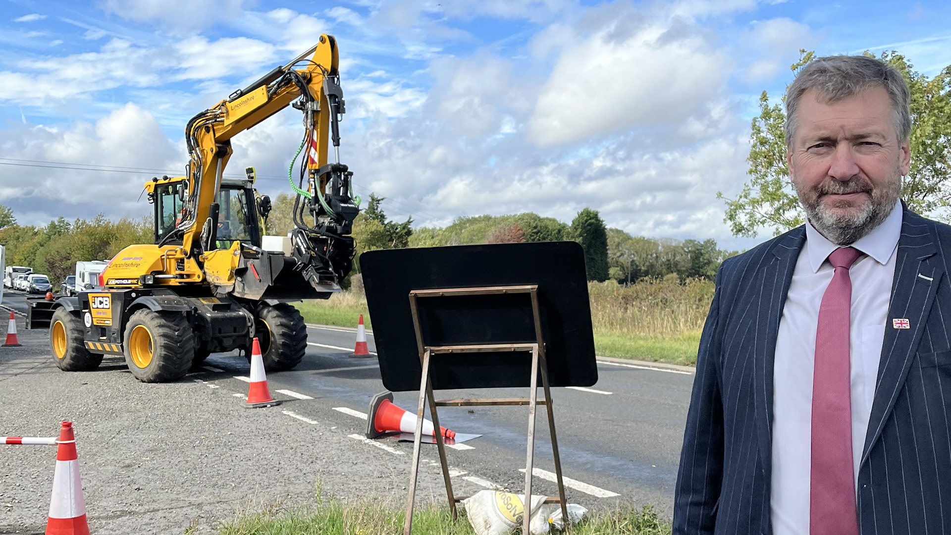 Cllr Sean Matthews, Leader of Lincolnshire County Council with the JCB Pothole Pro