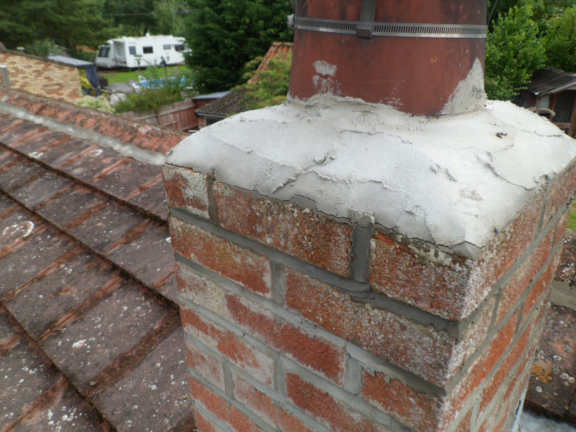 A chimney on a house roof