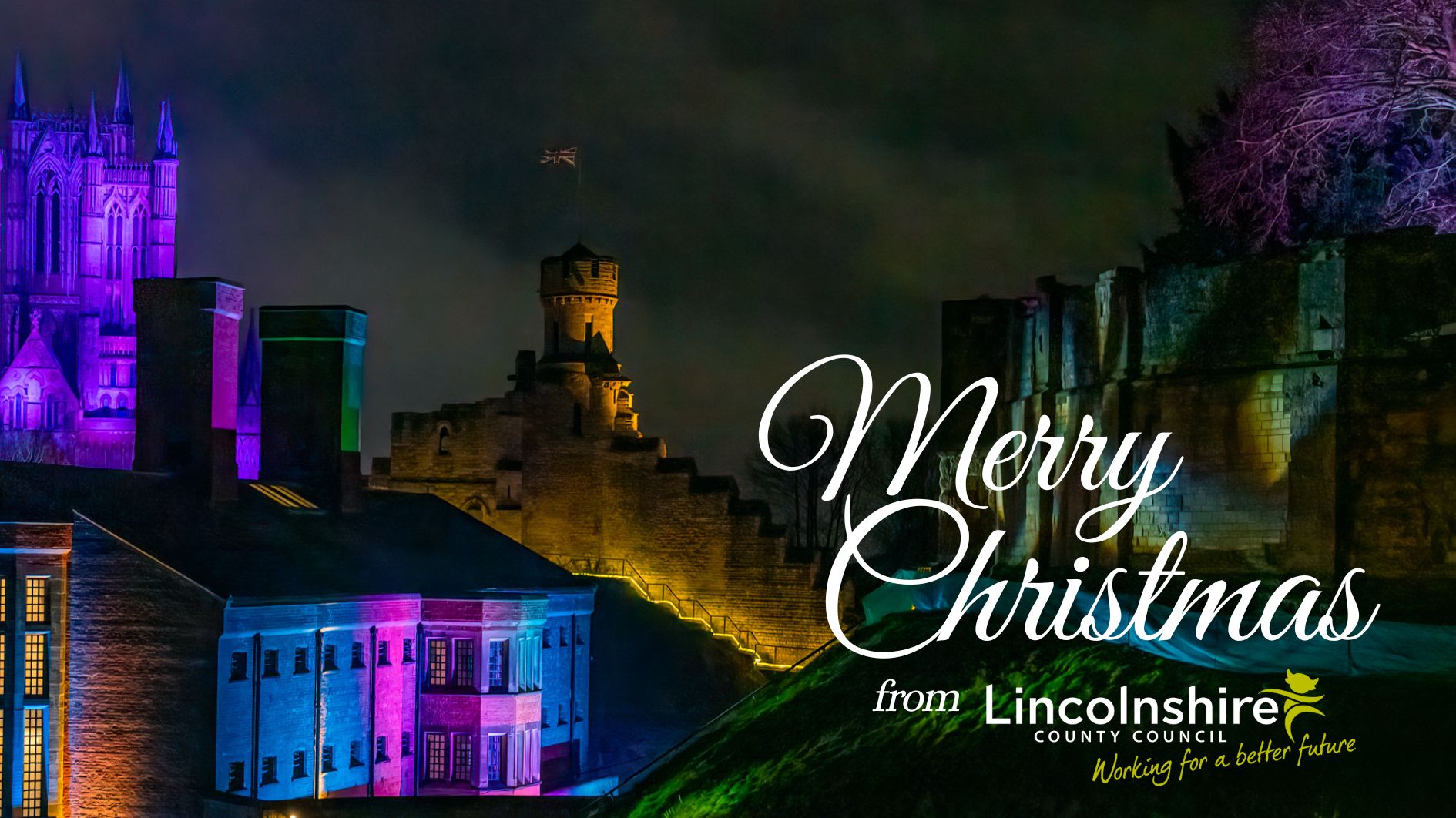 Lincoln Castle Illuminated, with text 'Merry Christmas from Lincolnshire County Council'