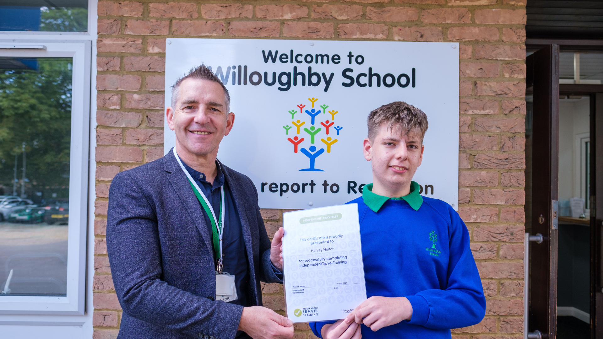 Mike Reed, head of transport at LCC, presents Harvey with his certificate