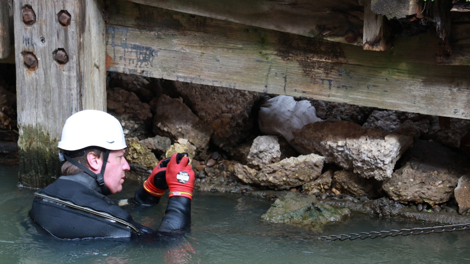 A specialist diver inspects conditions at the Glory Hole