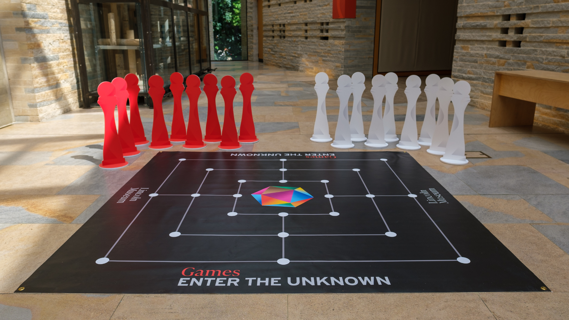 A large board game set up in a museum