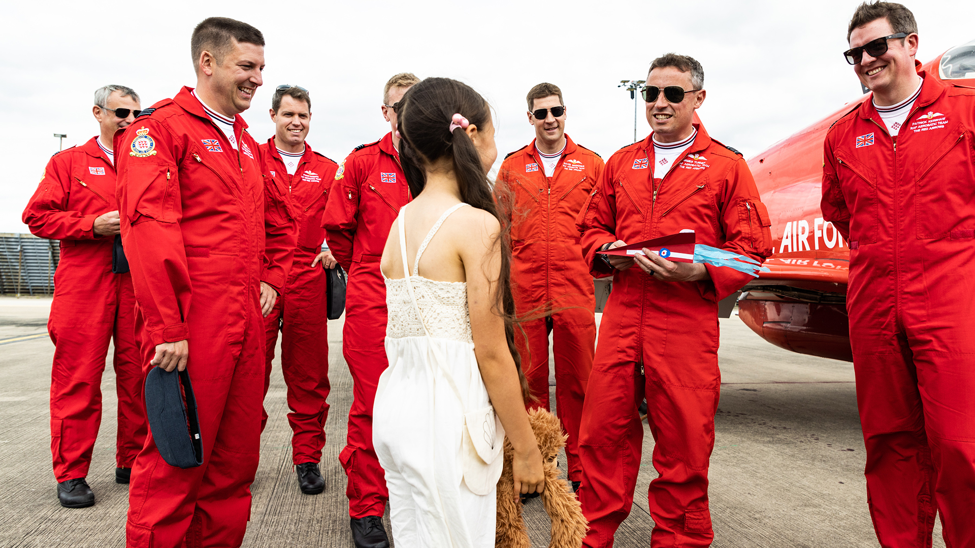 Image of Sofia presents the Red Arrows with her handmade aircraft: 