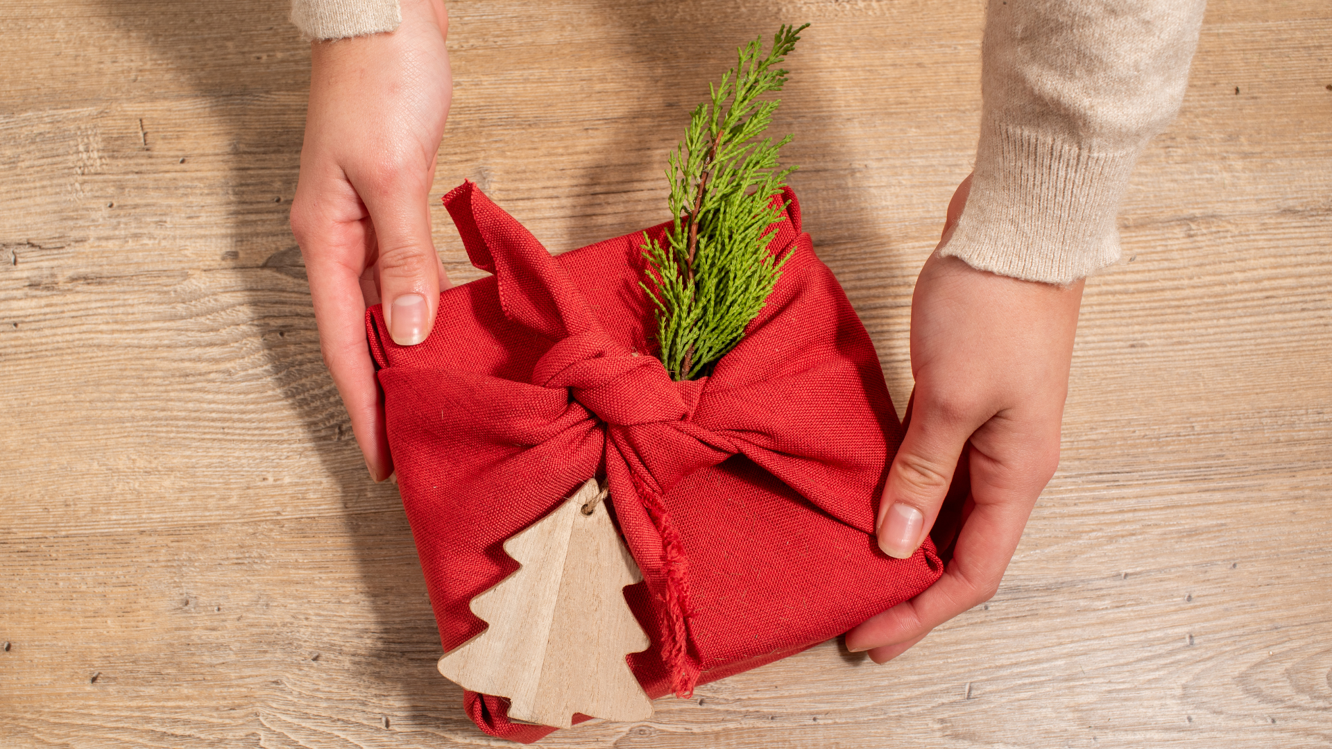 Christmas gift wrapped in fabric wrapping paper