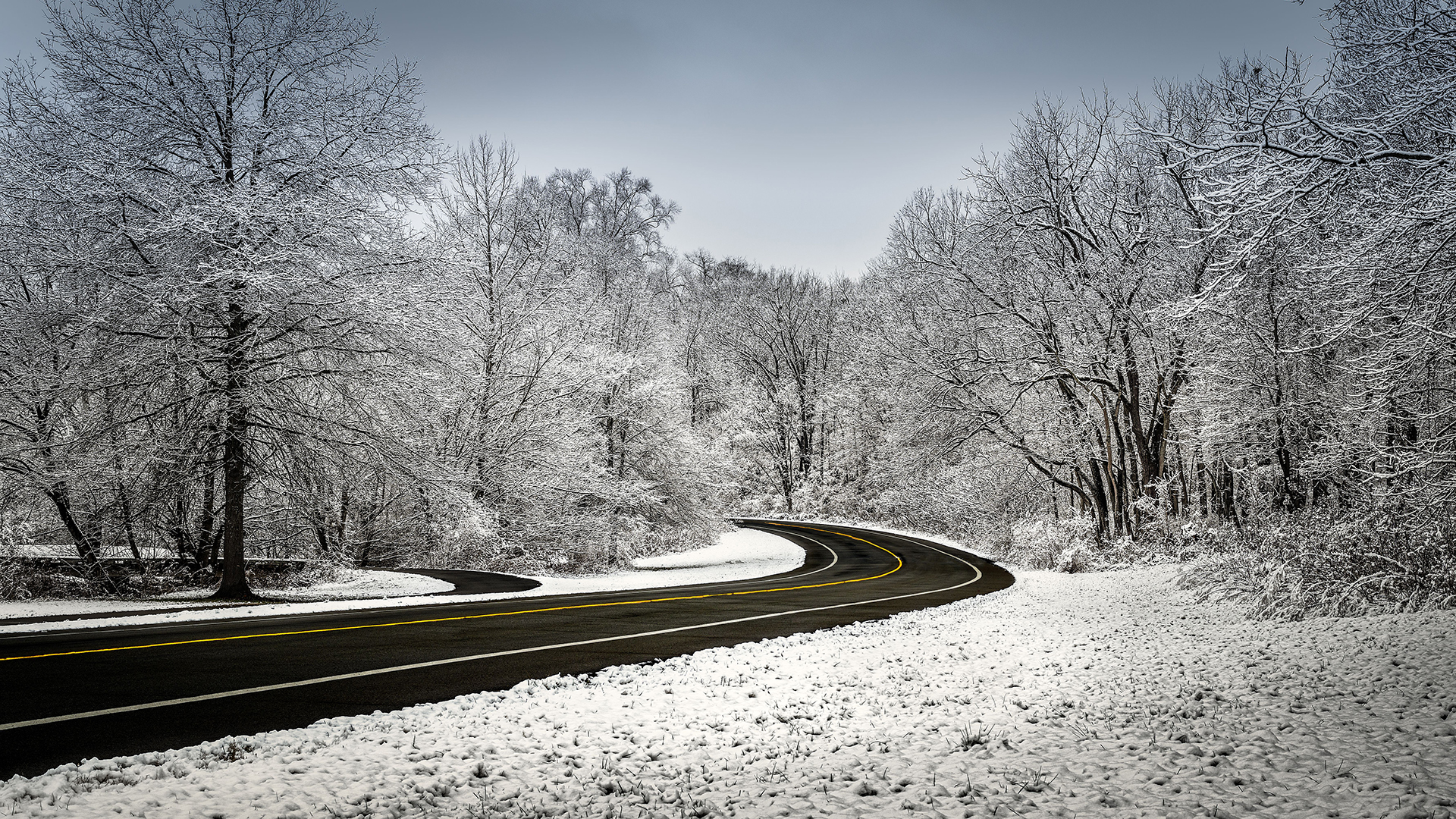 Image of a road surrounded by snow
