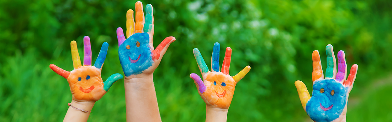 Image of children's hands covered in paint